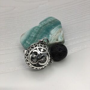 Ohm Aromatherapy Silver tone Locket.  Lava stone included.